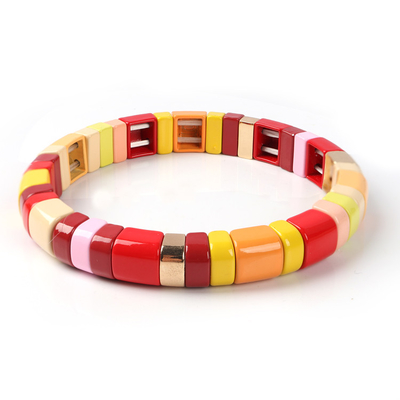 A liga feito a mão pintada do bracelete da telha do estiramento da cor crafted